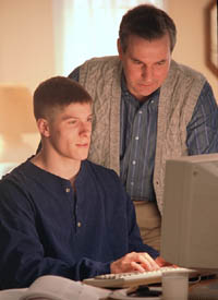 Picture of father and son at the computer
